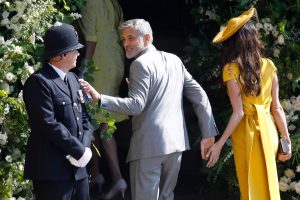zzzzinte1 TOPSHOT - US actor George Clooney (C) and his wife British lawyer Amal Clooney (R) arrive for the wedding ceremony of Britain's Prince Harry, Duke of Sussex and US actress Meghan Markle at St George's Chapel, Windsor Castle, in Windsor, on May 19, 2018. / AFP PHOTO / POOL AND AFP PHOTO / Odd ANDERSEN zzzz