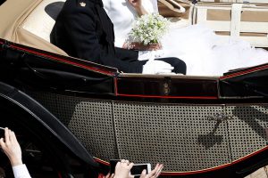 zzzzinte1 Britain's Prince Harry, Duke of Sussex (L) and his wife Meghan, Duchess of Sussex (R) begin their carriage procession in the Ascot Landau Carriage after their wedding ceremony at St George's Chapel, Windsor Castle, in Windsor, on May 19, 2018.  / AFP PHOTO / POOL AND AFP PHOTO / Odd ANDERSEN zzzz
