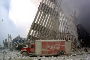 ****inte1A Coke truck sits among the rubble after the collapse of the first World Trade Center Tower 11 September, 2001 in New York. Two hijacked planes crashed into the twin towers causing the collapse of both.  AFP PHOTO  Doug KANTER  ****