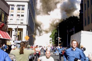 ****inte1Pedestrians run from the scene as one of the World Trade Center Towers collapses 11 September, 2001 in New York following a terrorist plane crash on the twin towers.  AFP PHOTO  Doug KANTER ****