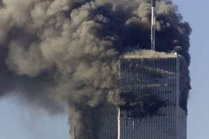 Smoke billows from the two World Trade Center towers after planes crashed into each tower, in New York on September 11, 2001.  REUTERS/Peter Morgan