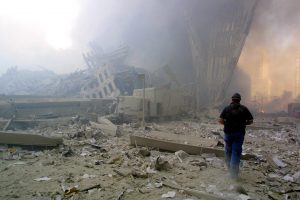 ****inte1A man walks through the rubble after the collapse of the first World Trade Center Tower 11 September, 2001 in New York. AFP PHOTO  Doug KANTER  ****