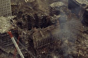 An aerial of the remains of the World Trade Center is seen September 26, 2001, over two weeks after the attacks on the World Trade Center and the Pentagon which left more than 6,000 people dead or missing. The United States sought to build confidence in its drive against global terrorism on Wednesday, lining up international diplomatic support while preparing new safety measures to coax nervous Americans back onto airplanes. REUTERS/Chief Brandon Brewer/U.S. Coast Guard