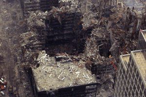 An aerial of the remains of the World Trade Center is seen September 26, 2001, over two weeks after the attacks on the World Trade Center and the Pentagon which left more than 6,000 people dead or missing. The United States sought to build confidence in its drive against global terrorism on Wednesday, lining up international diplomatic support while preparing new safety measures to coax nervous Americans back onto airplanes. REUTERS/Chief Brandon Brewer/U.S. Coast Guard