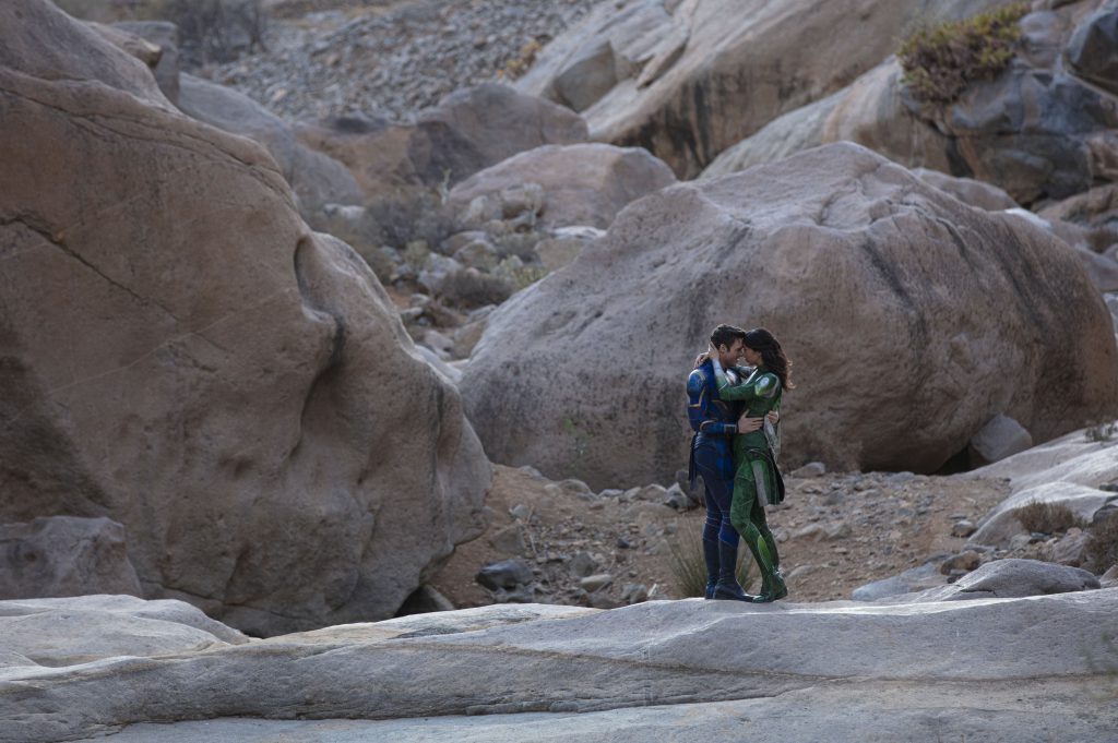 (L-R): Ikaris (Richard Madden) and Sersi (Gemma Chan) in Marvel Studios' ETERNALS. Photo by Sophie Mutevelian. © 2021 Marvel Studios. All Rights Reserved.