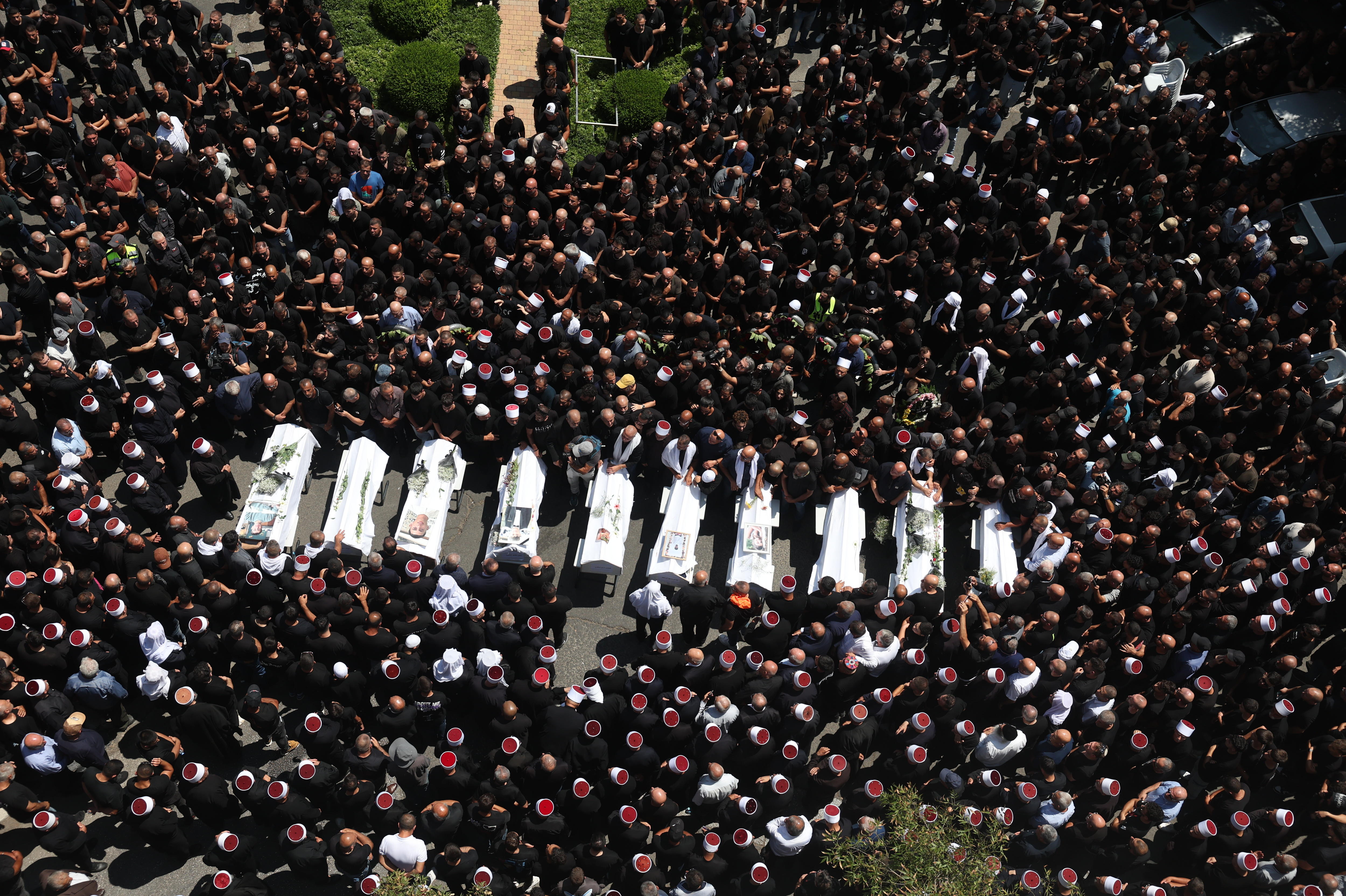 Relatives attend funeral of victims in Majdal Shams, after missile attack from Lebanon